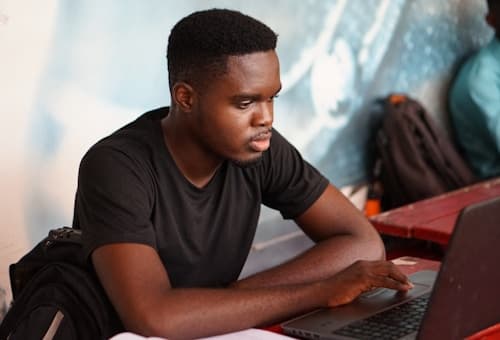 A learner using a donated laptop